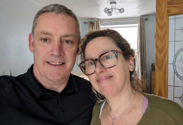 Foster carers Ian and Toni side-by-side and smiling