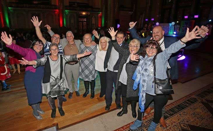 Fostering community together on a night out, waving hands