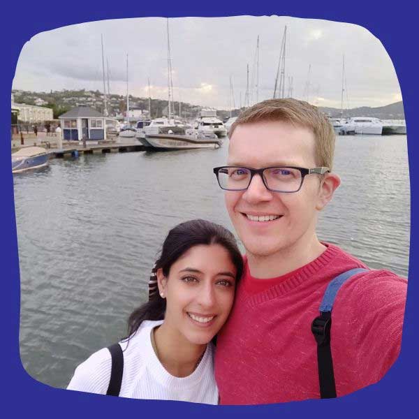 Male and female couple taking selfie at harbour