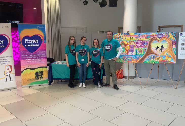 Members of Liverpool Foster Team standing in Alder Hey Hospital Atrium