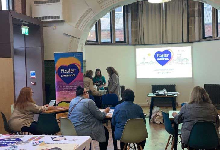 The foster team and members of public at a fostering event