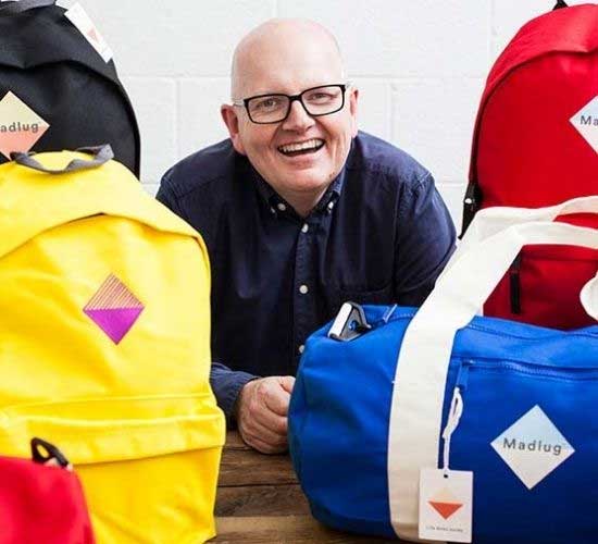 David Linton Founder of Madlug with different types of Madlug bags